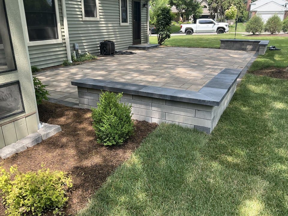 An exterior view of a DuPage home foundation with new drainage tile at the perimeter.