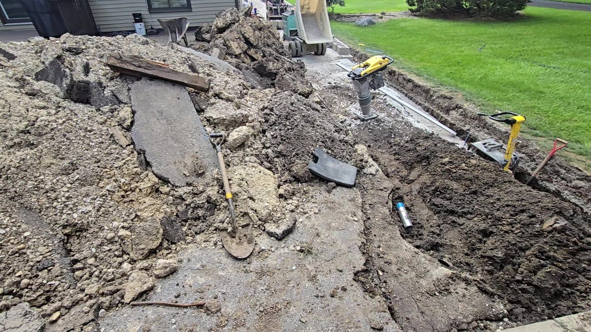 Underground utility installation on a DuPage County property at golden hour.